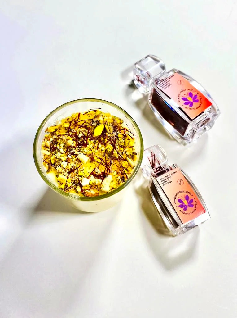 A bowl of deep red Herati saffron threads next to a branded Authentic Afghan Saffron teacup filled with golden saffron tea