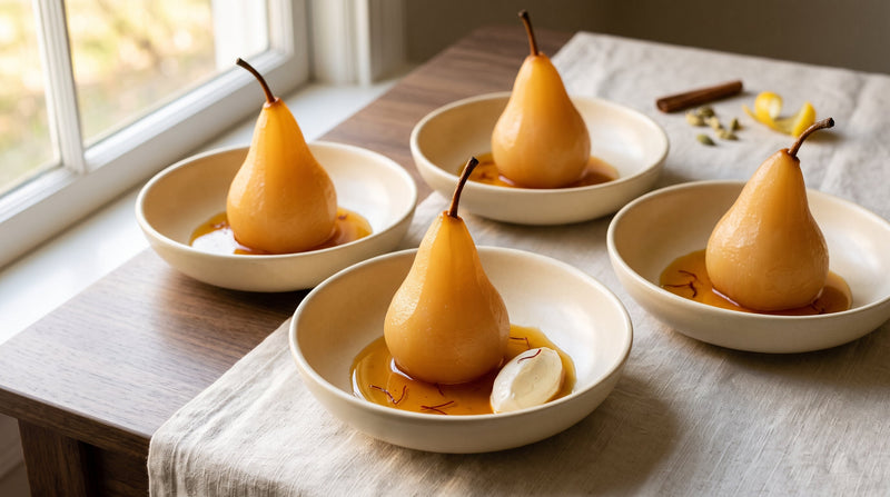 Four upright saffron-poached Bosc pears in reduced amber syrup with crème fraîche, cardamom, and lemon